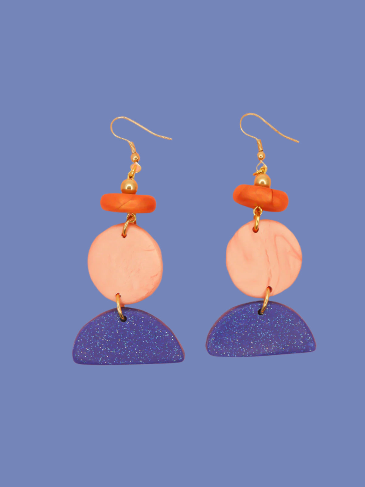 Geometric 3 tier dangle statement earrings with a blue glitter semi circle, rose gold circle & a rust bead, topped with a brass ball bead and gold plated ear wires