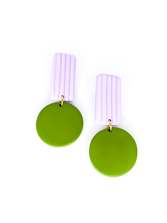 Pair of geometric earrings with green round pendants and purple striped rectangle on a white background