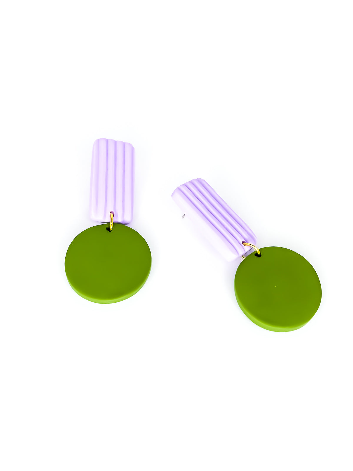 Pair of geometric earrings with green round pendants and purple striped rectangle on a white background