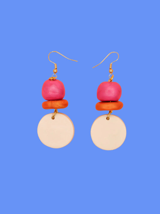 Lightweight metallic beaded dangle earrings with a pearl circle, topped with hand rolled metallic beads in pink and rust, hung from gold plated ear wires