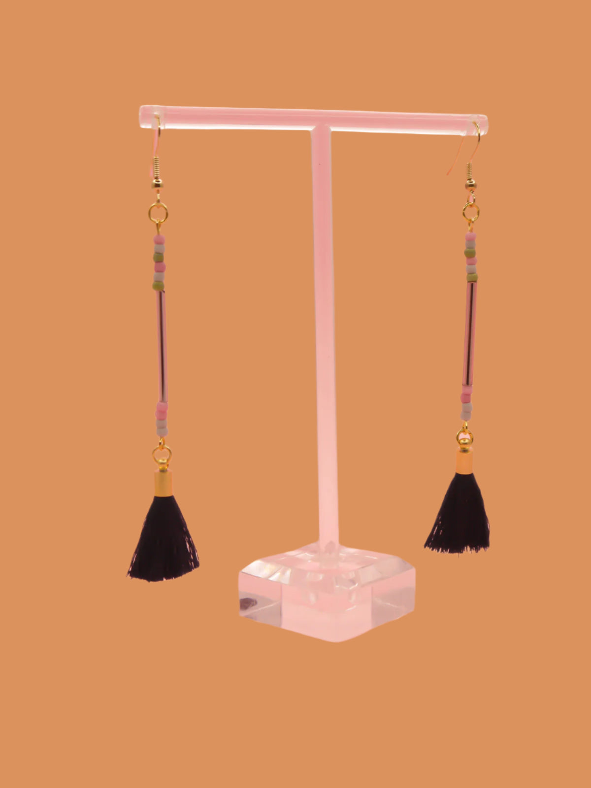 Long delicate bead stick dangle earrings with a lilac glass tube bead & seed beads in green, pink & grey, paired with a navy tassel and hung from gold plated nickel free ear wires