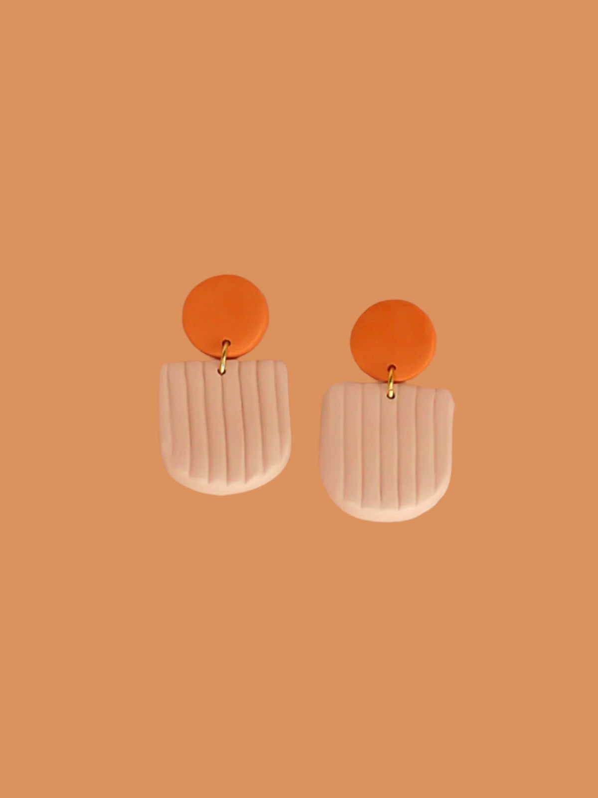 Modern arch dangle statement earrings in beige textured striped arch with a terracotta stud, made out of polymer clay with a stainless steel posts.