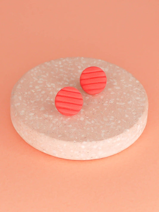 Mini coral polymer clay studs in a textured stripe