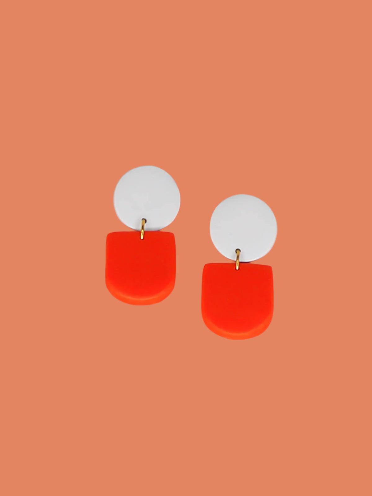 Lightweight arch dangle geometric earrings with a red arch & a pale blue stud, with stainless steel posts, made out of polymer clay