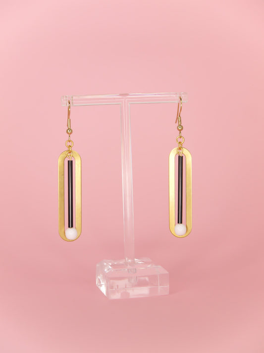 Black & white glass beads hung from a rectangle brass with gold plated ear wires