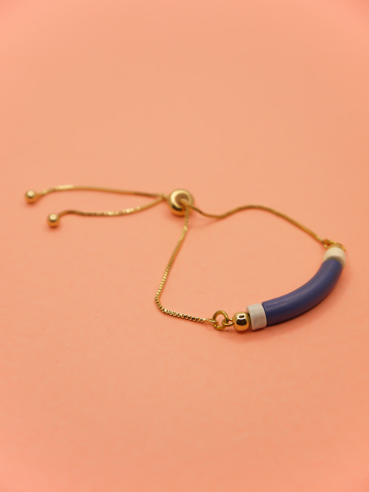 Blue curved ceramic bead gold chain bracelet