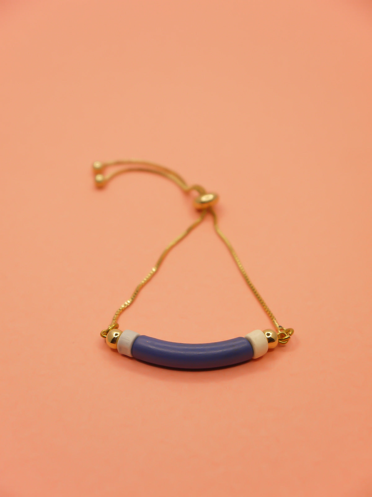 Blue curved ceramic bead gold chain bracelet