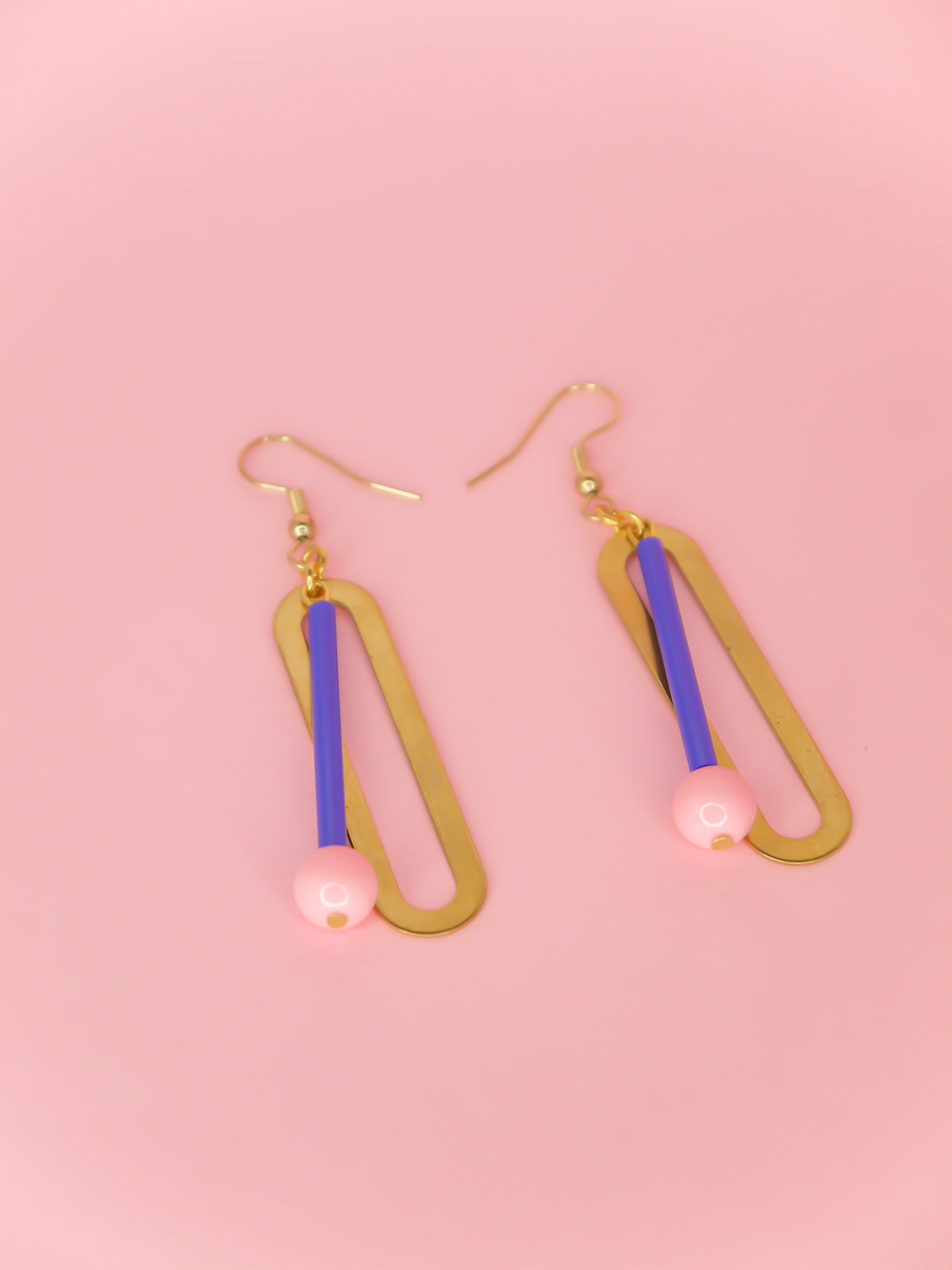 Blue & pink glass beads hung from a rectangle brass with gold plated ear wires