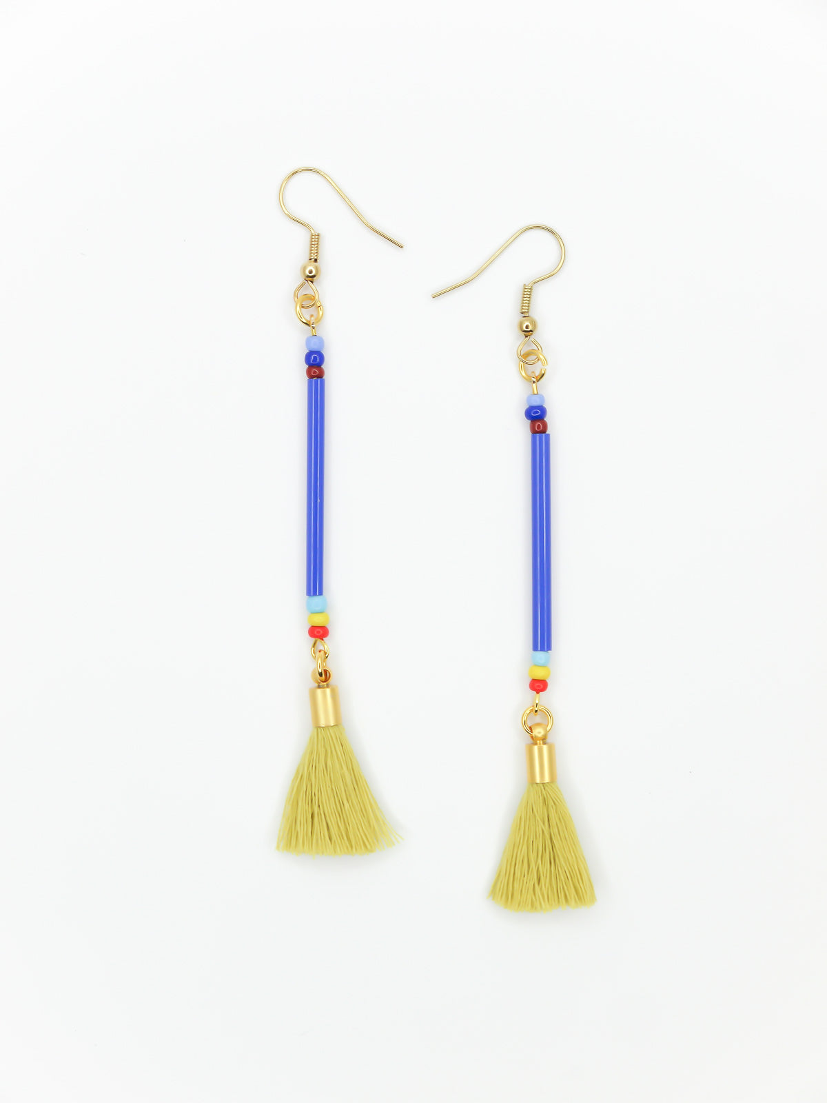 Long bead stick dangle earrings with blue glass tube beads & contrasting seed beads in blue, red & yellow. Paired with a chartreuse cotton tassel and hung from gold plated nickel free ear wires