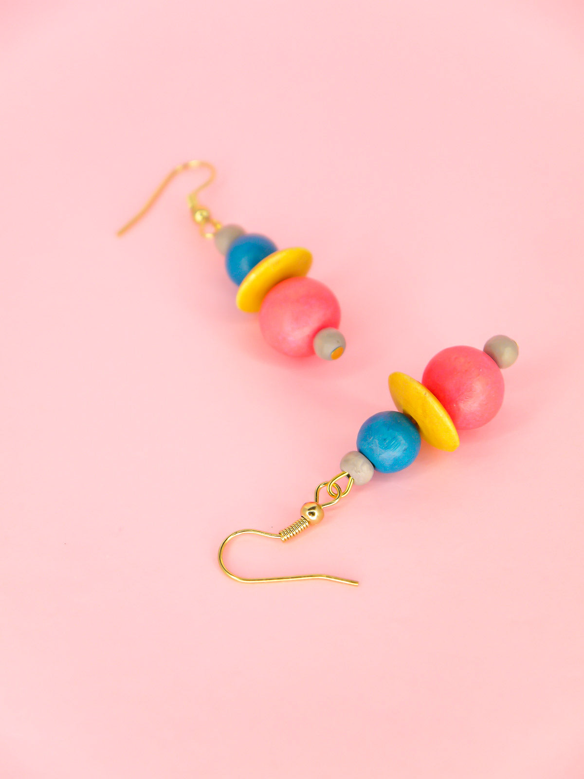 Colourful lightweight wooden bead dangle earrings in grey, blue, yellow & pink beads, hung from gold plated ear wires