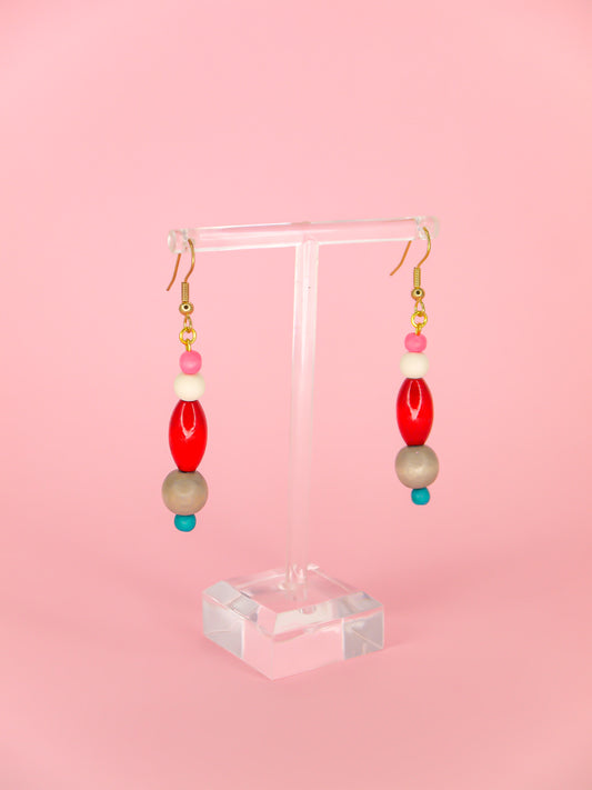 Colourful lightweight wooden bead dangle earrings in various shaped beads in pink, white, red, grey & blue, hung from gold plated ear wires