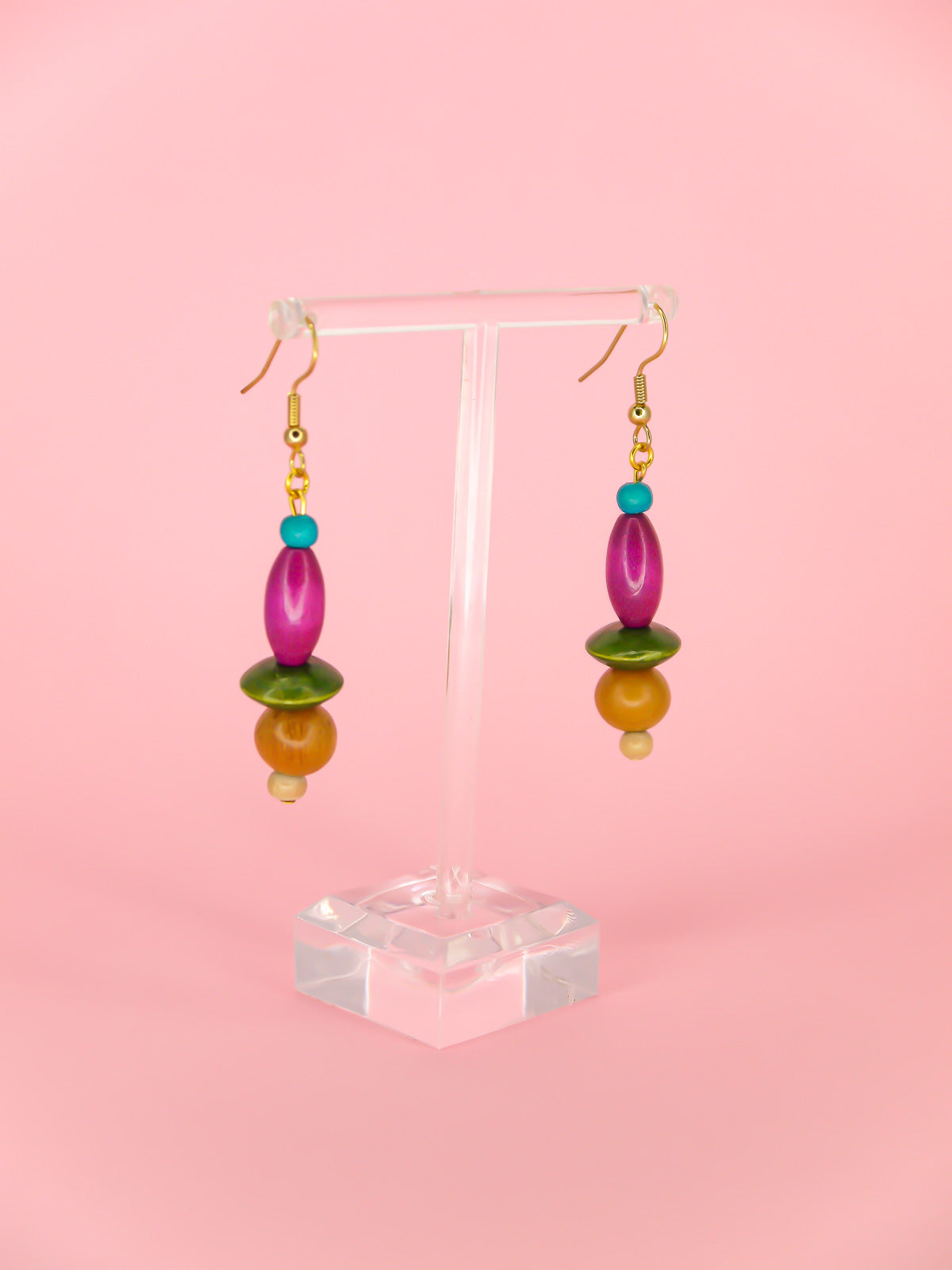 Colourful lightweight wooden bead dangle earrings in various shaped beads in blue, purple, green & browns, hung from gold plated ear wires