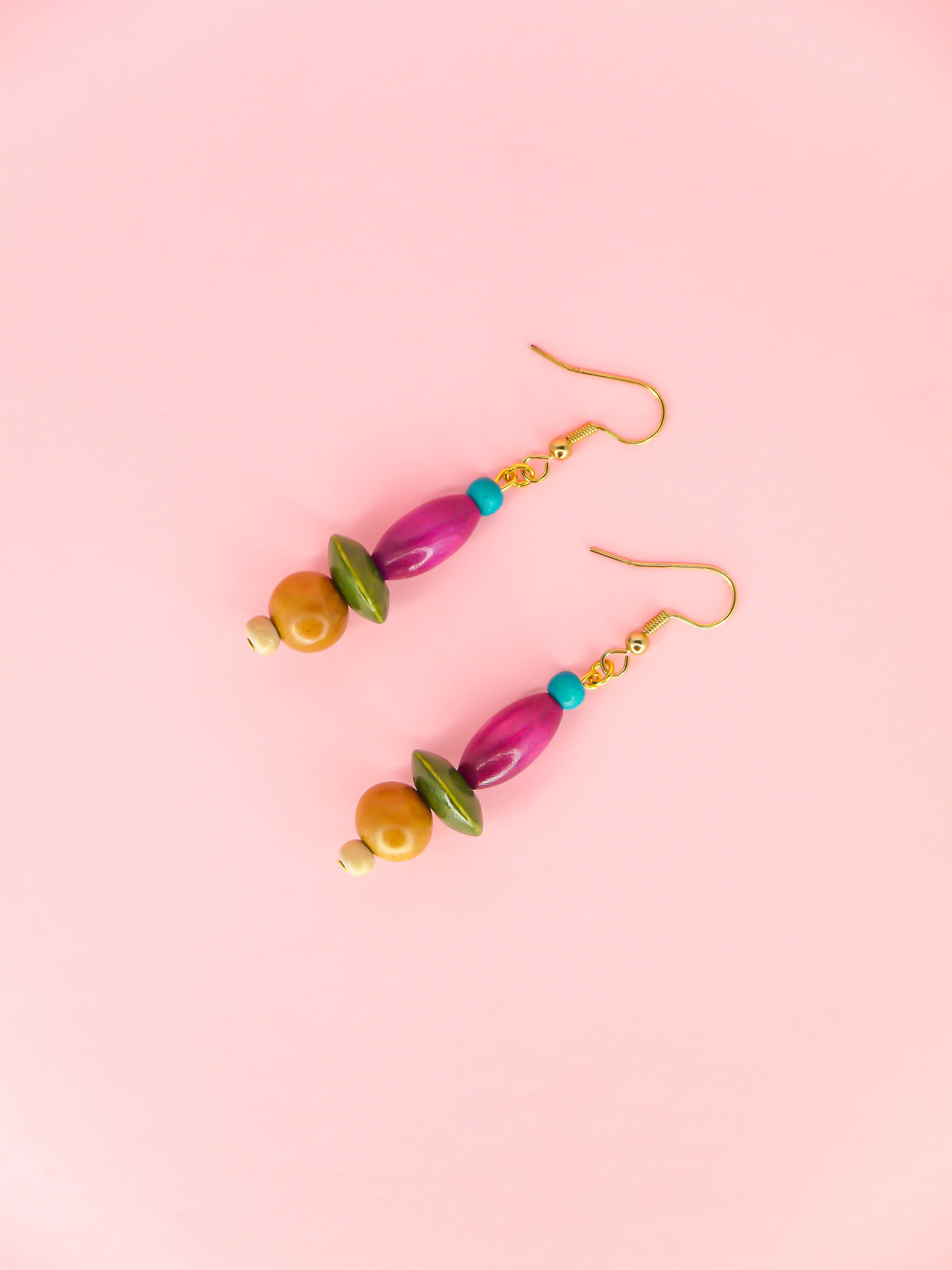 Colourful lightweight wooden bead dangle earrings in various shaped beads in blue, purple, green & browns, hung from gold plated ear wires