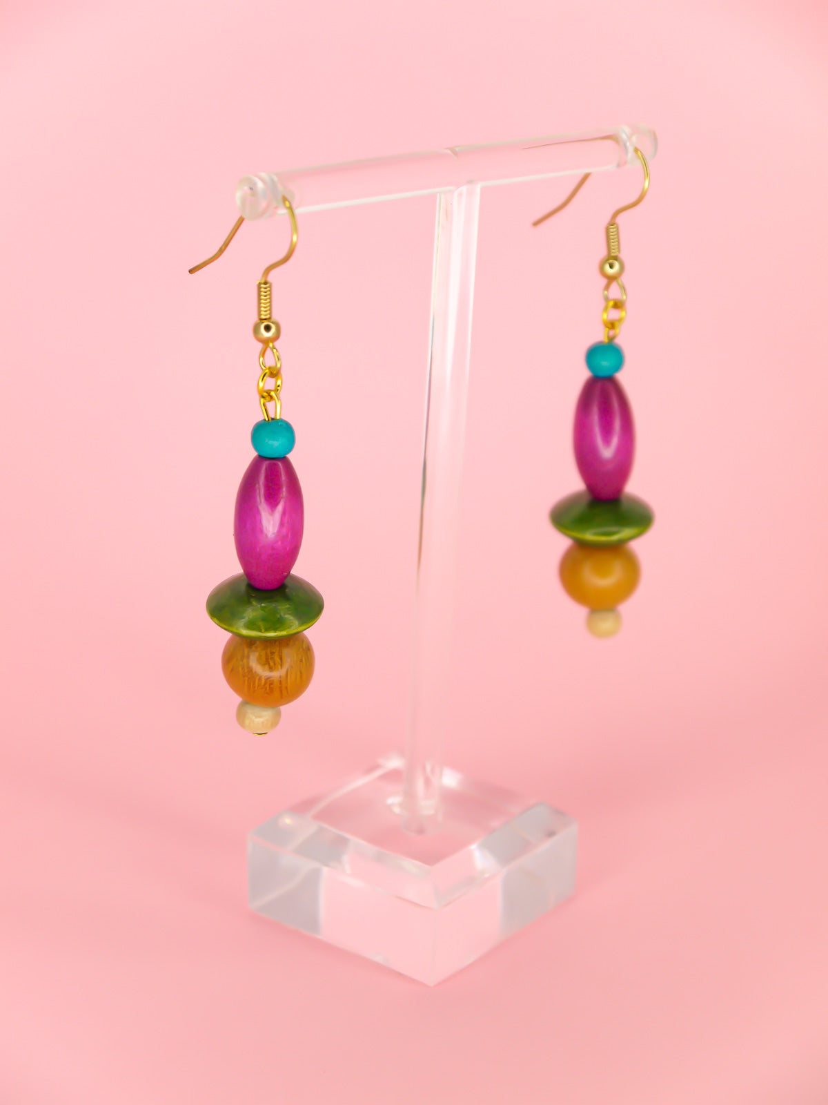 Colourful lightweight wooden bead dangle earrings in various shaped beads in blue, purple, green & browns, hung from gold plated ear wires