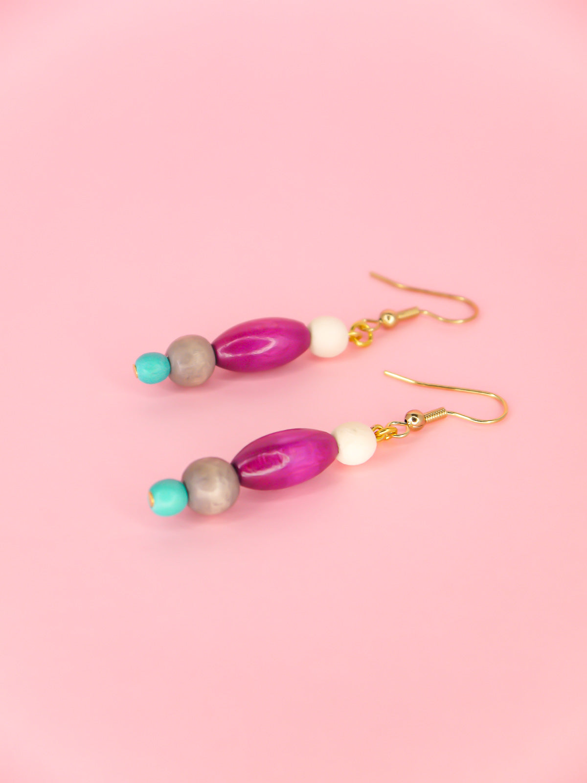 Colourful lightweight beaded dangle earrings in various shaped beads in white, purple, grey & blue, hung from gold plated ear wires