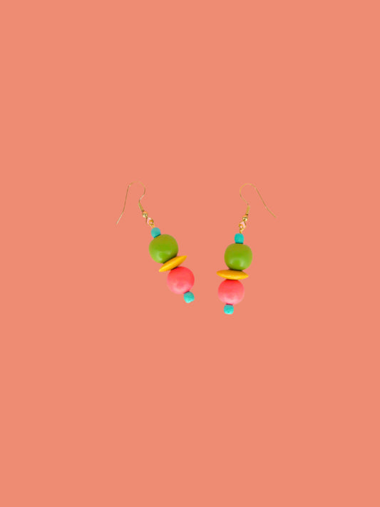Colourful lightweight dangle earrings in wooden beads of various shapes in blue, green, yellow & pink. Hung from gold plated ear wires.