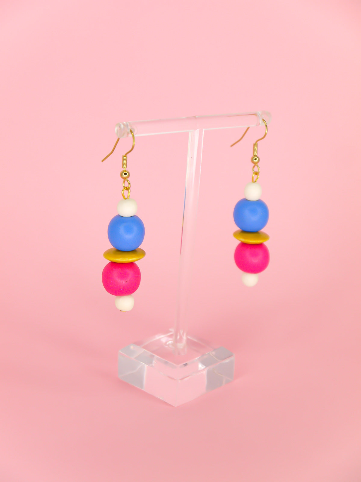 Colourful lightweight wooden bead dangle earrings in white, blue, pink & yellow various sized beads, hung from gold plated ear wires