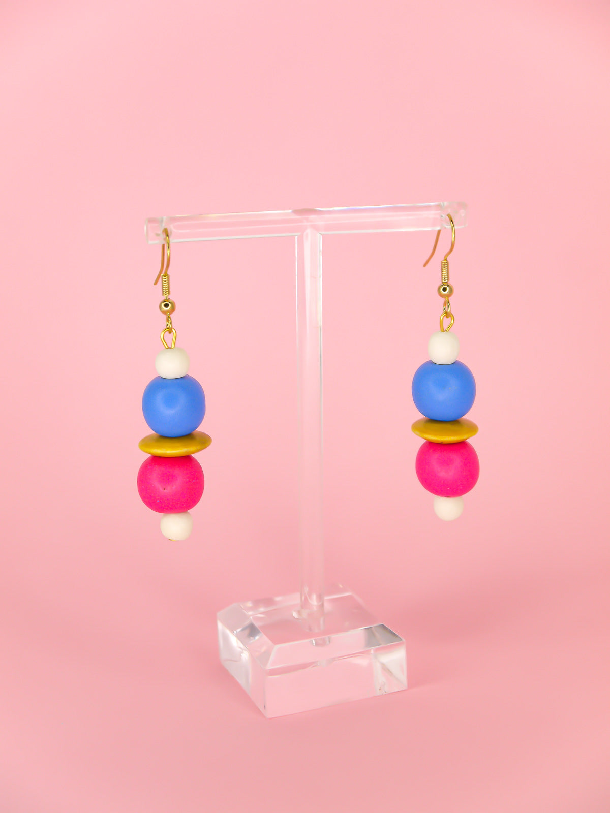 Colourful lightweight wooden bead dangle earrings in white, blue, pink & yellow various sized beads, hung from gold plated ear wires