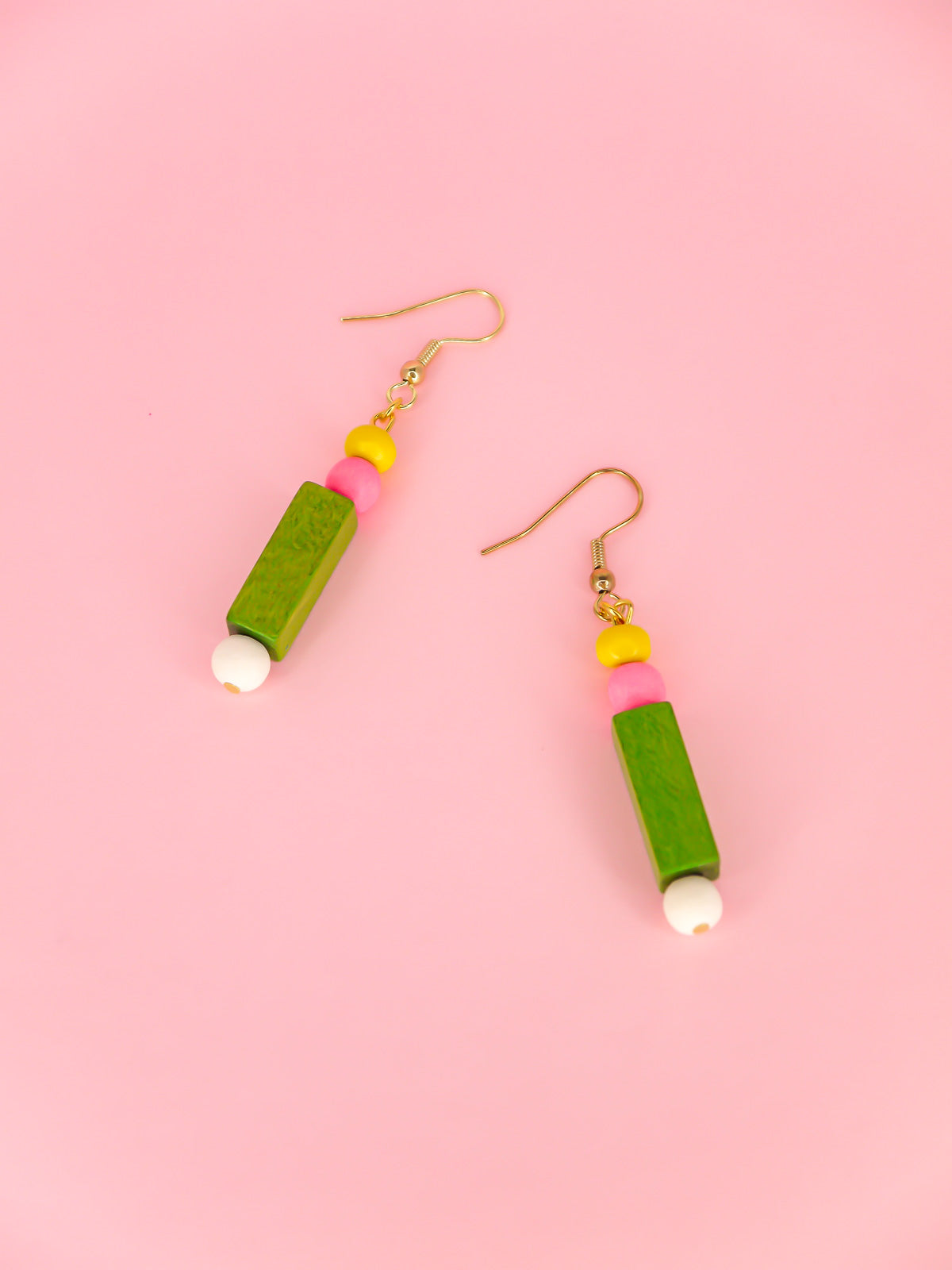 Colourful lightweight wooden bead dangle earrings comprising yellow, pink, green & white beads in various shapes and sizes, hung from gold plated ear wires