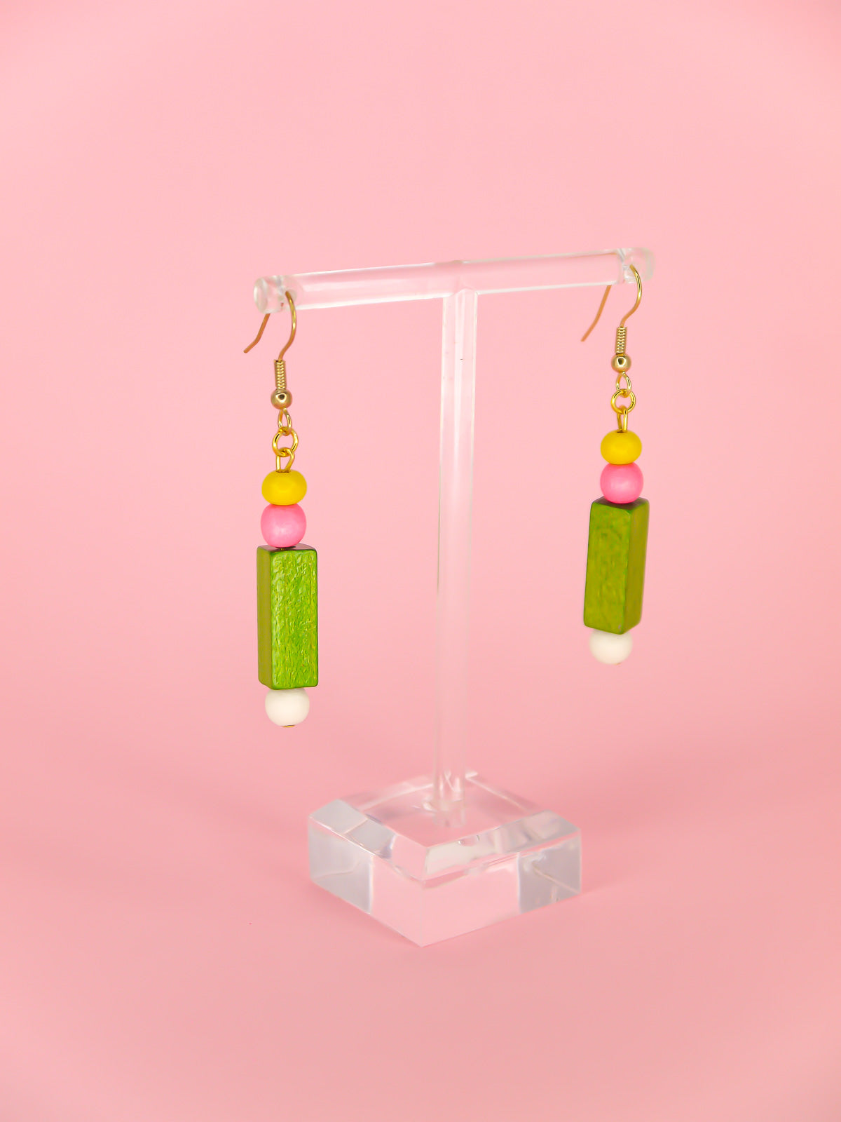 Colourful lightweight wooden bead dangle earrings comprising yellow, pink, green & white beads in various shapes and sizes, hung from gold plated ear wires