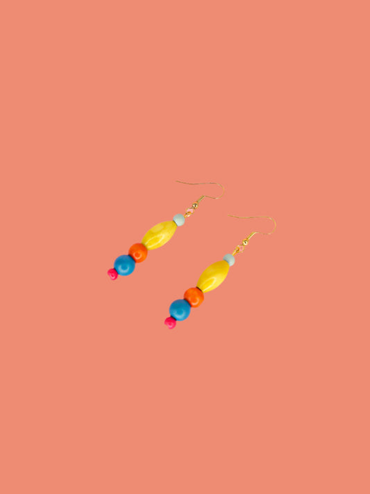 Colourful lightweight wooden bead dangle earrings in various shaped beads in blue, yellow, orange & pink, hung from gold plated ear wires