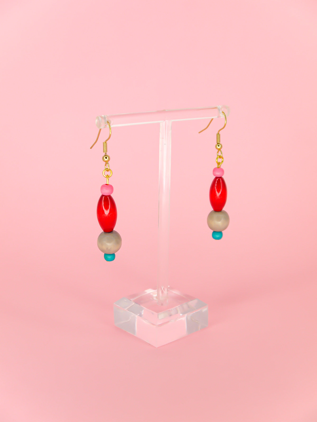 Colourful lightweight wooden bead dangle earrings in various shaped beads in pink, red, grey & blue, hung from gold plated ear wires