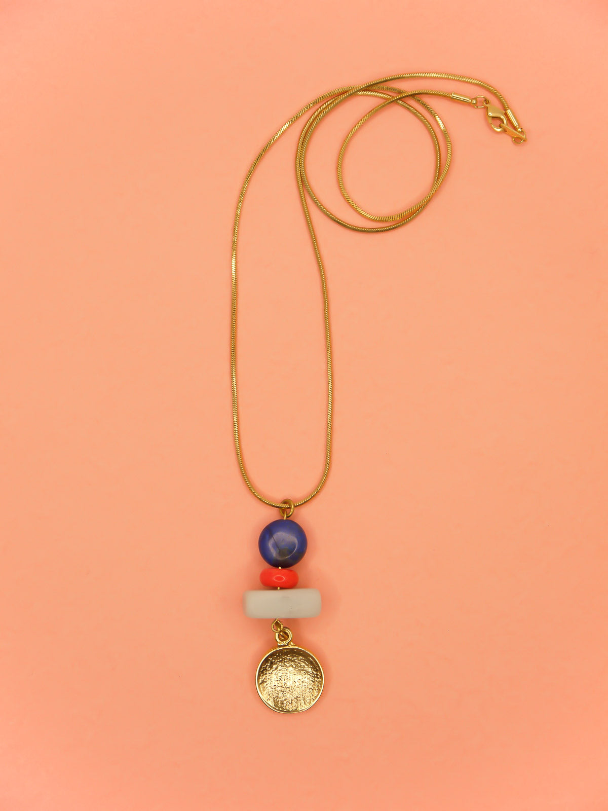 Crystal gemstone pendant necklace with lapis lazuli, coral and amazonite bead stack with a 24k shiny gold hammered disk medallion strung on a 24k gold plated snake chain