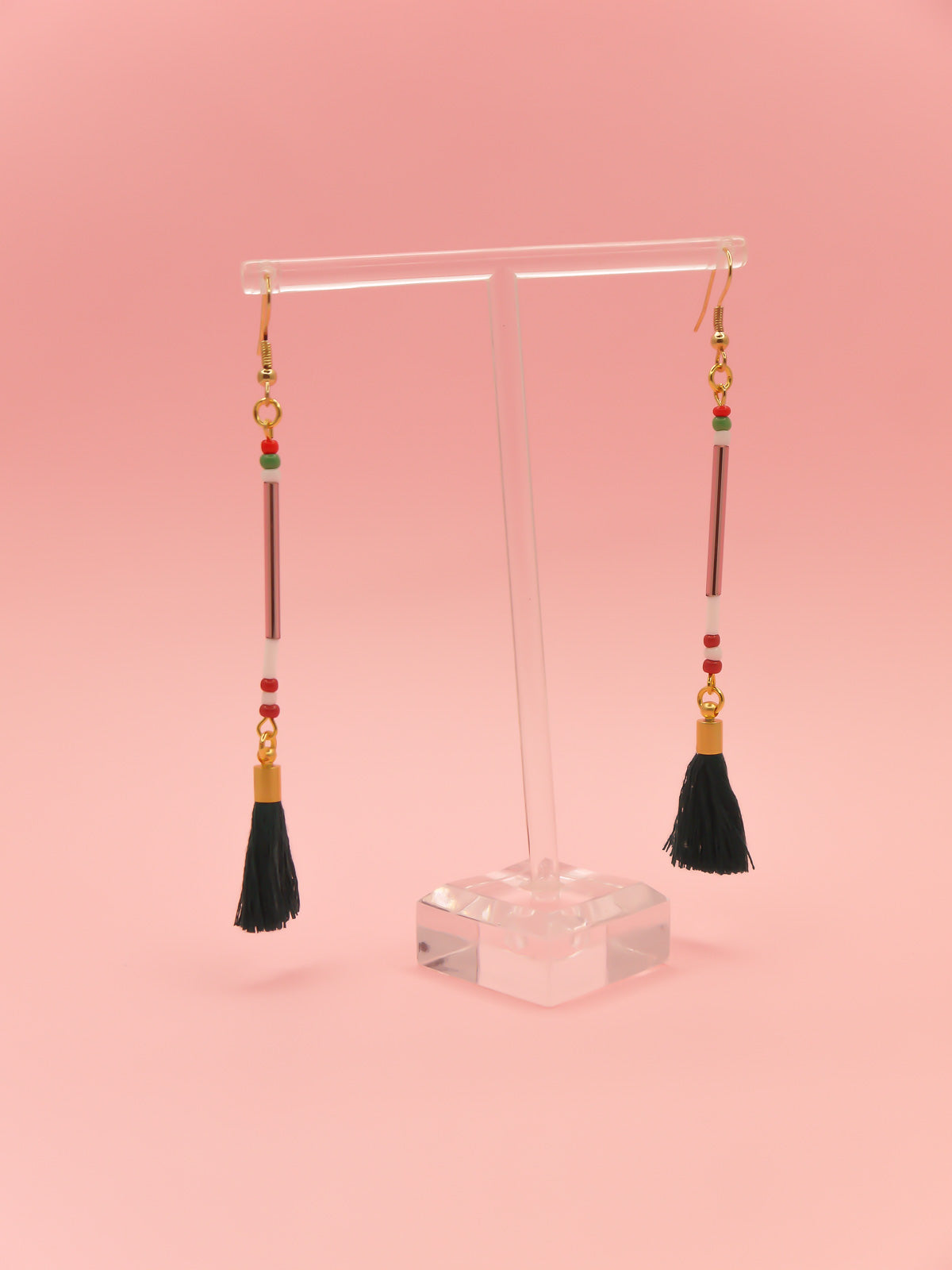 Lightweight long delicate bead stick dangle earrings with lilac glass tube beads & contrasting seed beads in green, white & red, paired with a dark green cotton tassel. Hung from gold plated nickel free ear wires.