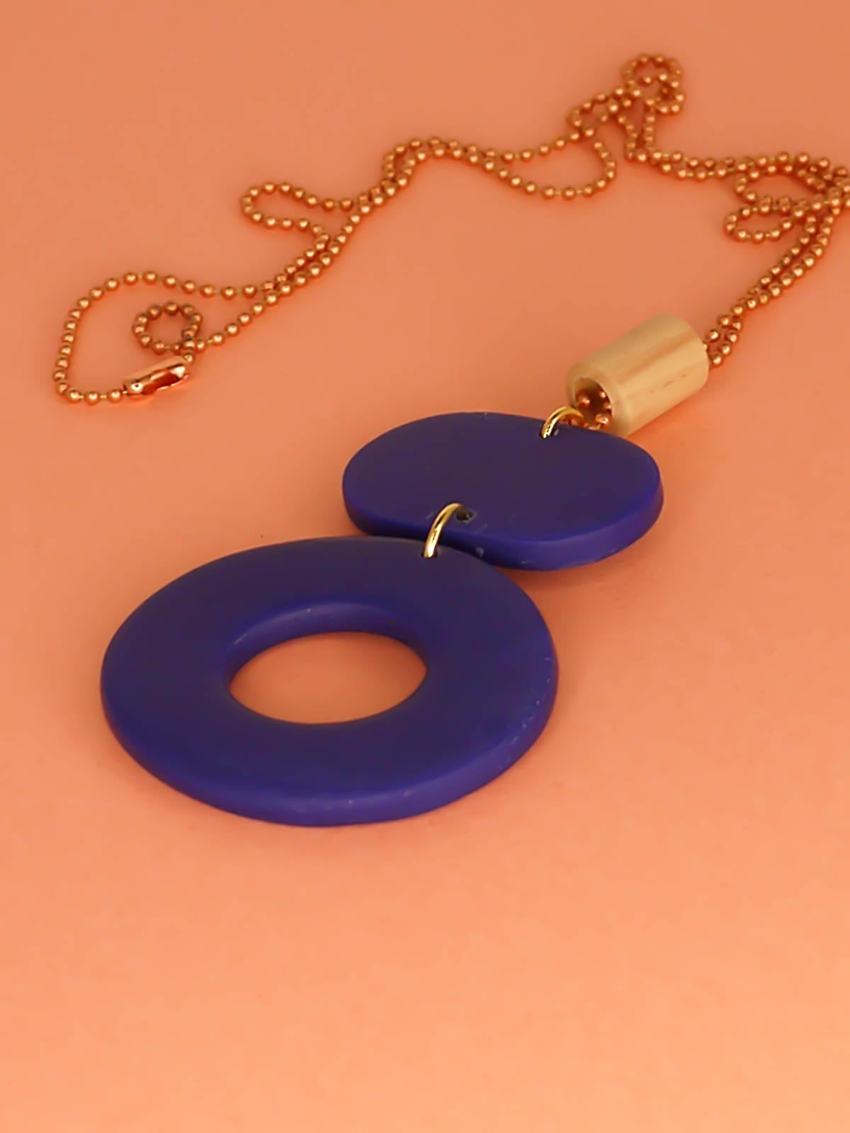 Geometric polymer clay pendant necklace with cobalt blue hoop circle, rectangle & a wooden tube bead strung on a copper ball chain