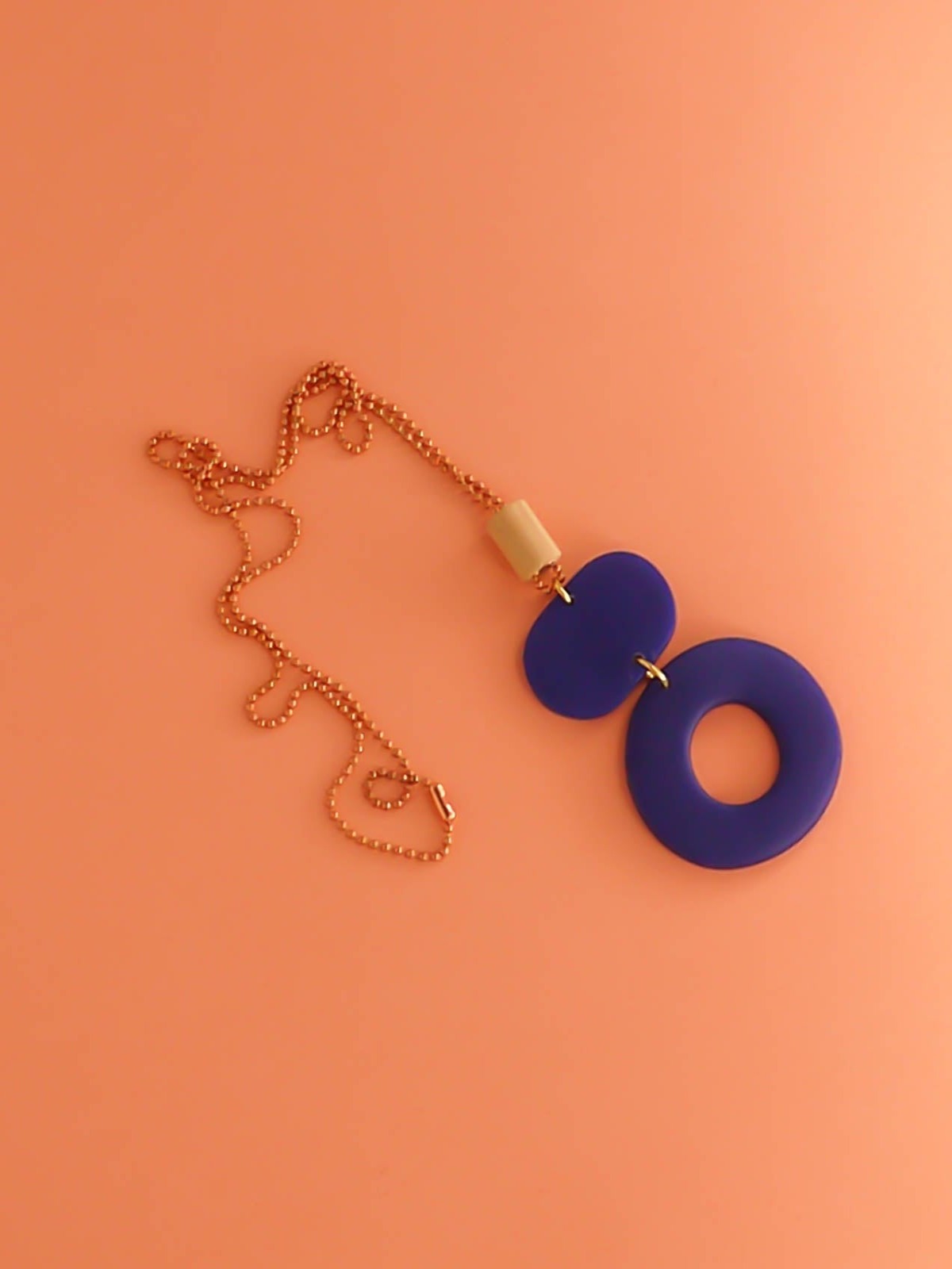 Geometric polymer clay pendant necklace with cobalt blue hoop circle, rectangle & a wooden tube bead strung on a copper ball chain