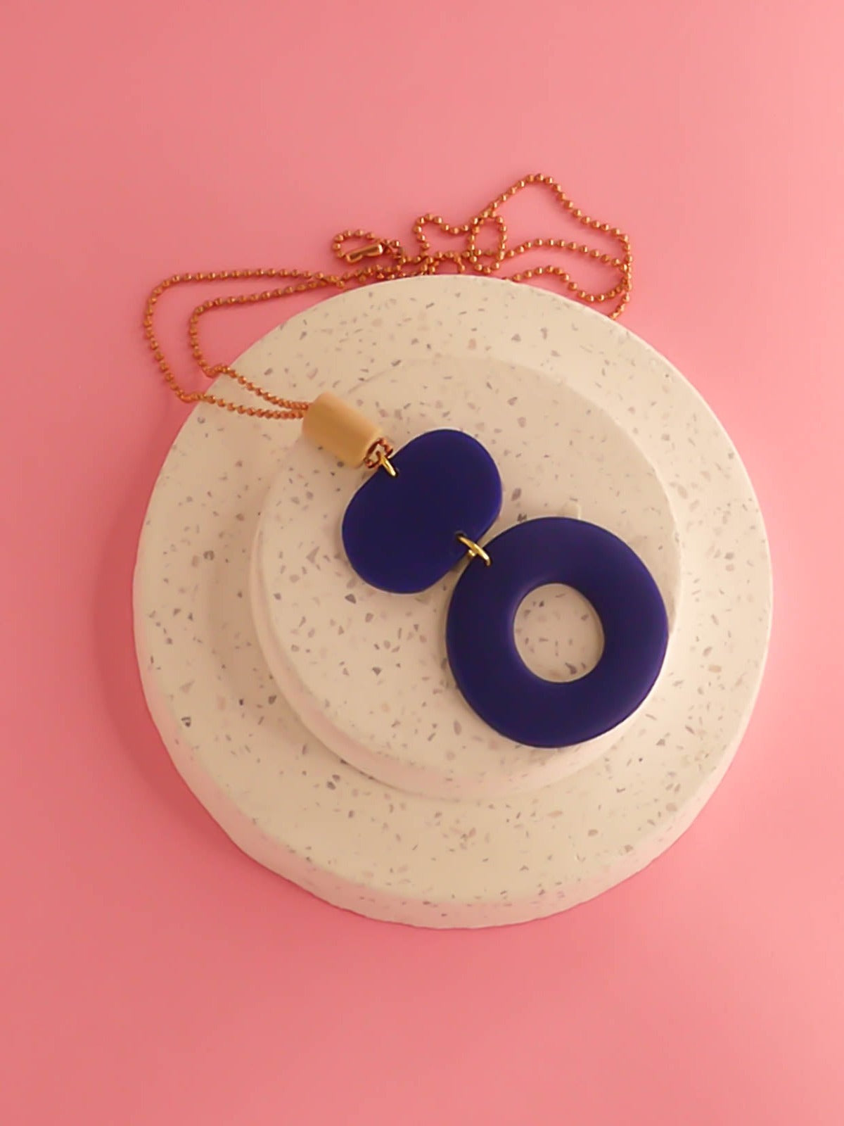 Geometric polymer clay pendant necklace with cobalt blue hoop circle, rectangle & a wooden tube bead strung on a copper ball chain