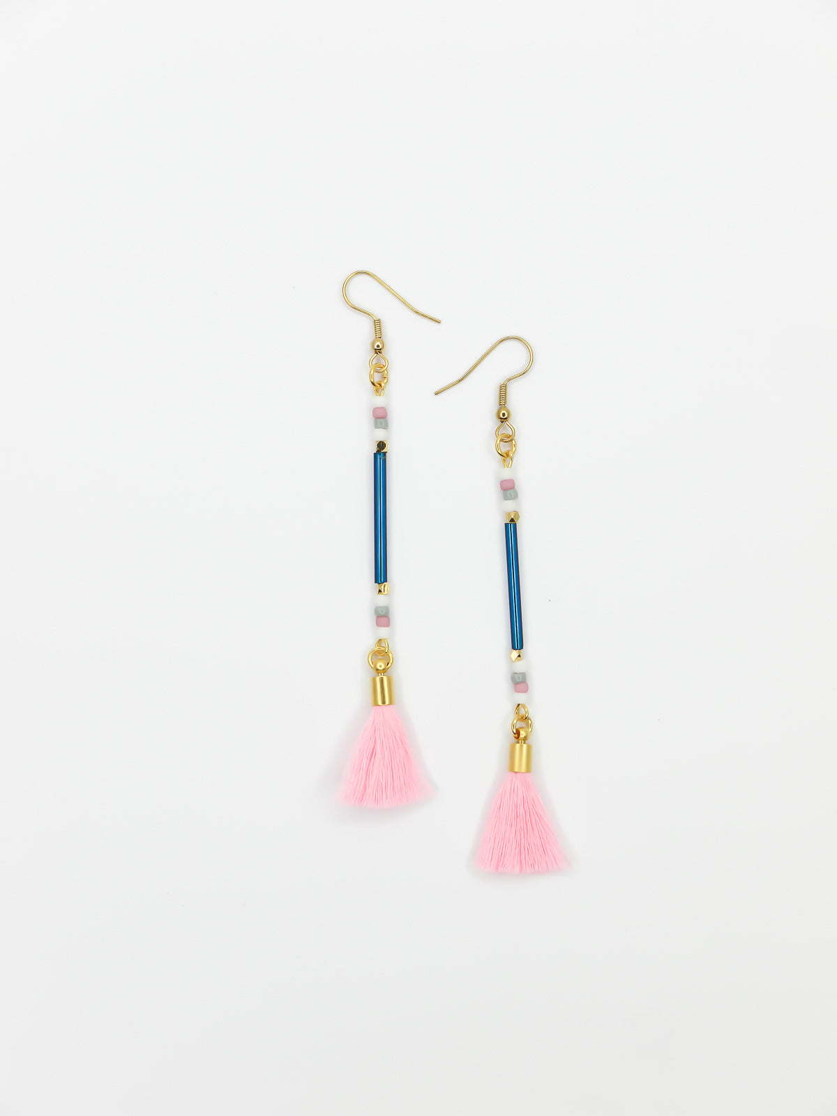 Long beaded tassel earrings with blue glass tube beads and white, pink & grey seed beads with a light pink cotton tassel and hung from gold plated nickel free ear wires