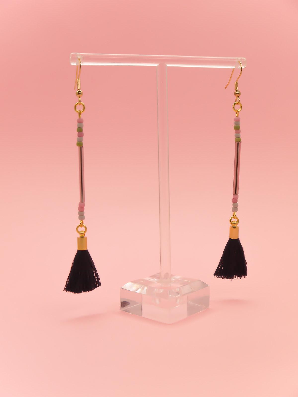 Long delicate bead stick dangle earrings with a lilac glass tube bead & seed beads in green, pink & grey, paired with a navy tassel and hung from gold plated nickel free ear wires