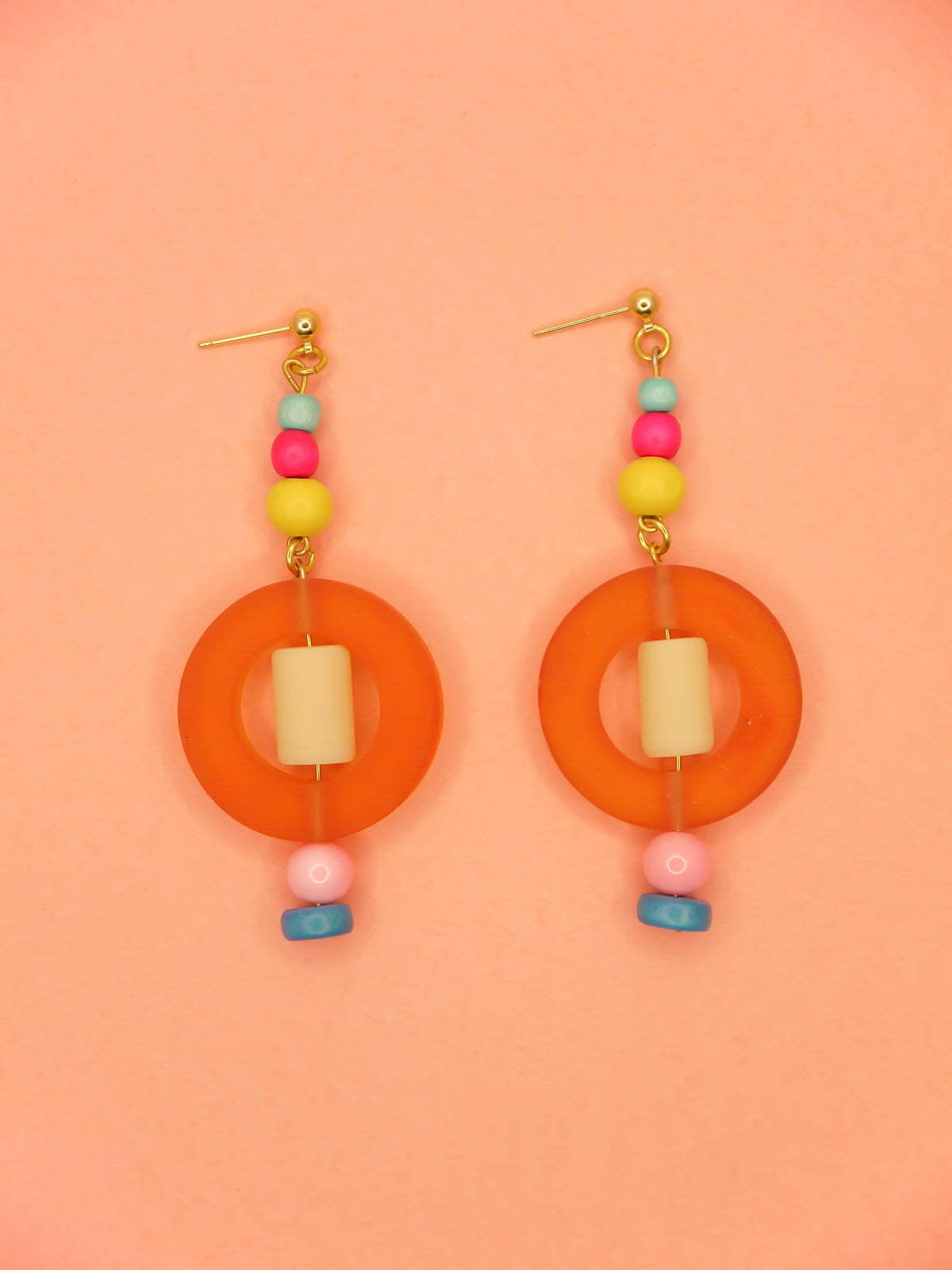 Colourful lightweight hoop bead earrings with glass & wood beads in yellow, pink & turquoise with a resin orange hoop in the centre & a resin cream tube bead in the middle. Hung from 24k gold plated ball studs.