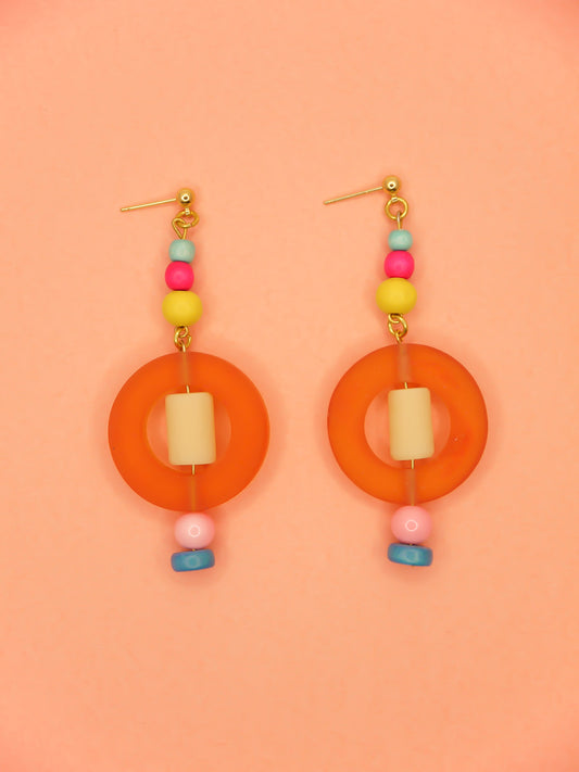 Colourful lightweight hoop bead earrings with glass & wood beads in yellow, pink & turquoise with a resin orange hoop in the centre & a resin cream tube bead in the middle. Hung from 24k gold plated ball studs.