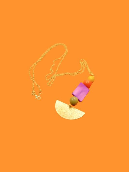 Lightweight geometric necklace featuring a textured brass semi circle charm with glass beads in green, orange & yellow with a purple mother of pearl square bead. Hung from 24k gold plated cable chain.