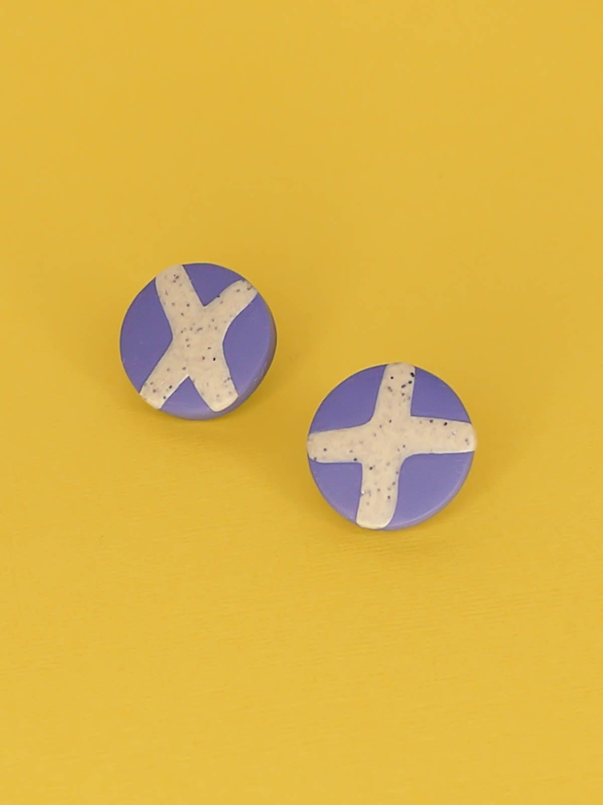 Lightweight geometric periwinkle blue polymer clay stud circle earrings with a granite cross in the centre