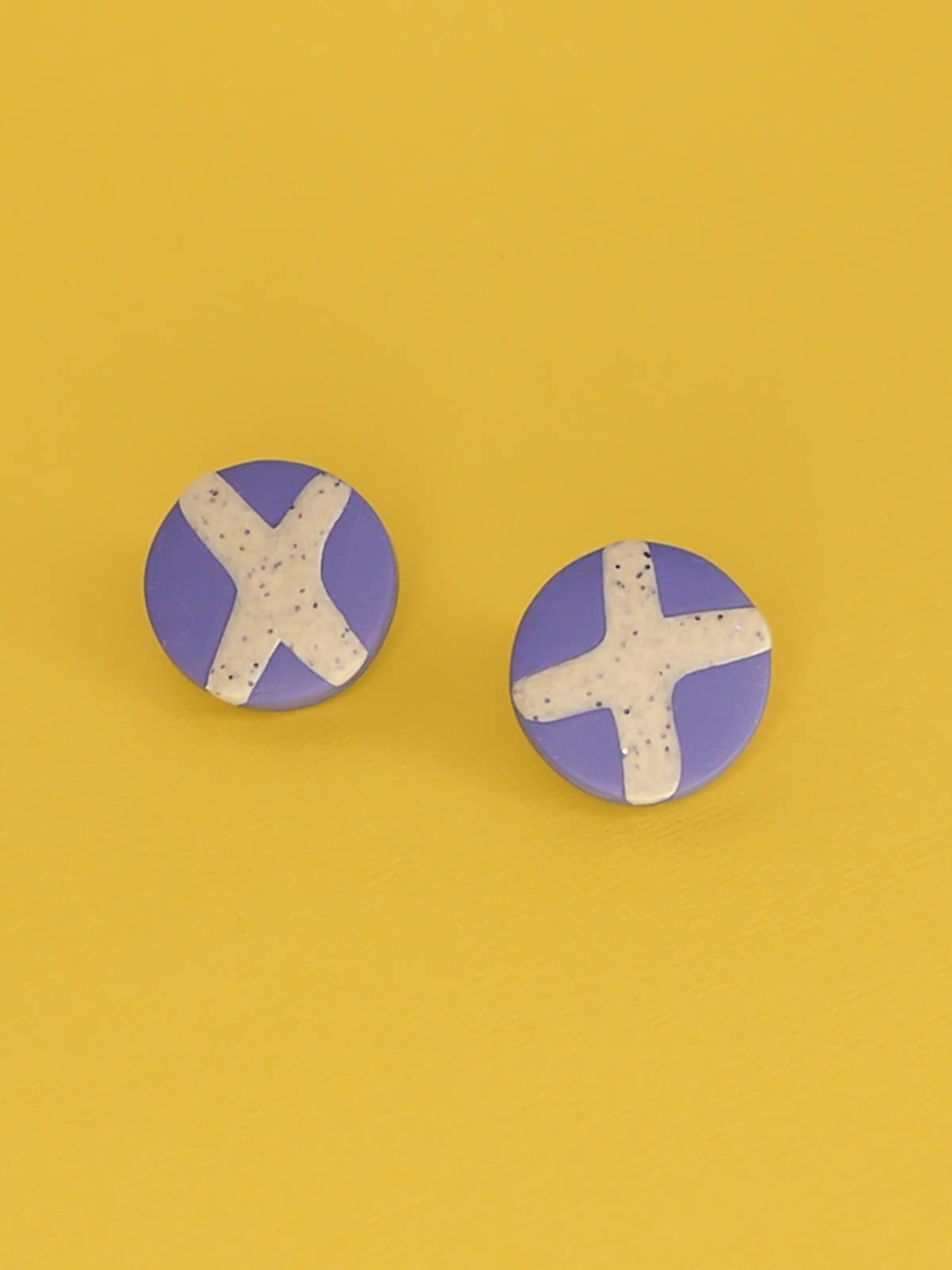 Lightweight geometric periwinkle blue polymer clay stud circle earrings with a granite cross in the centre