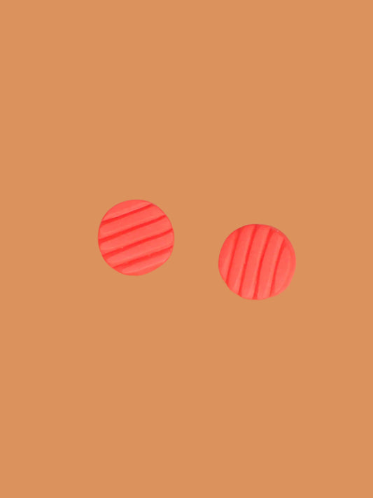 Mini coral polymer clay studs in a textured stripe