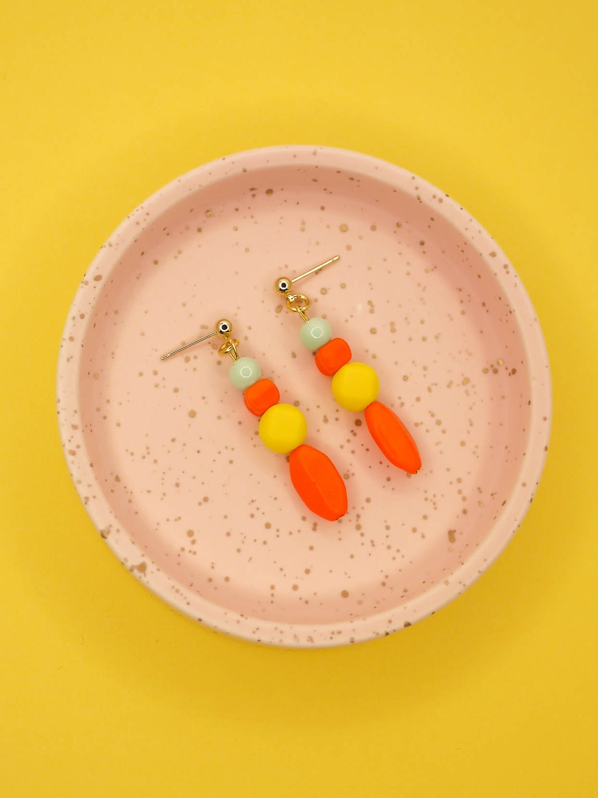 Geometric colour block bead drop earrings in multi coloured resin and glass beads in orange, yellow and mint hung from 24k gold plated brass ball studs.