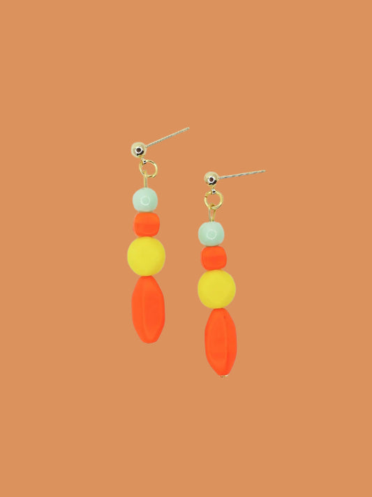Geometric colour block bead drop earrings in multi coloured resin and glass beads in orange, yellow and mint hung from 24k gold plated brass ball studs.