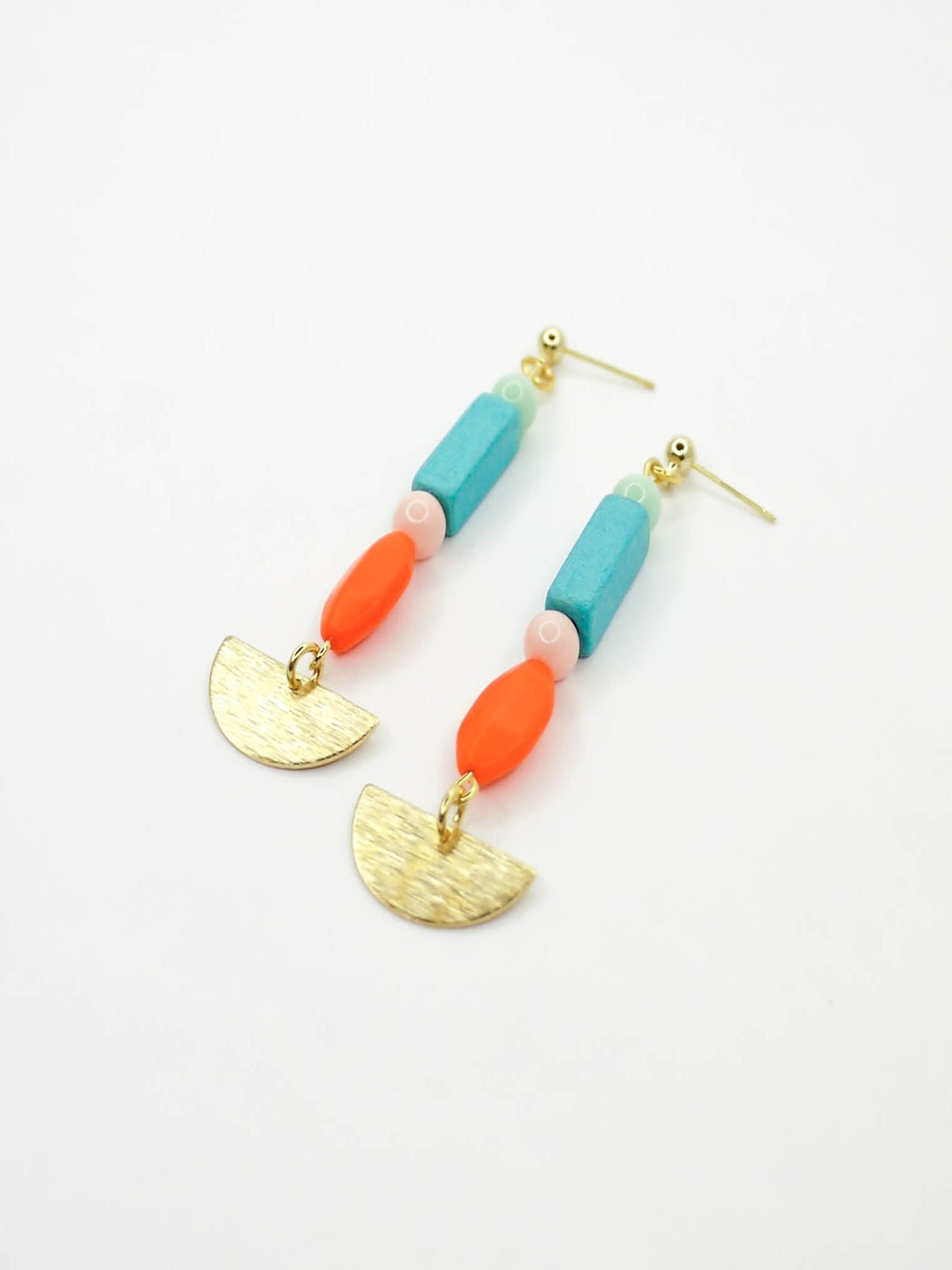 Geometric colourful bead dangle earrings with a textured brass semi circle and beads in ceramic, glass and resin in orange, pink, turquoise and mint. Hung from 24k gold plated brass ball studs.