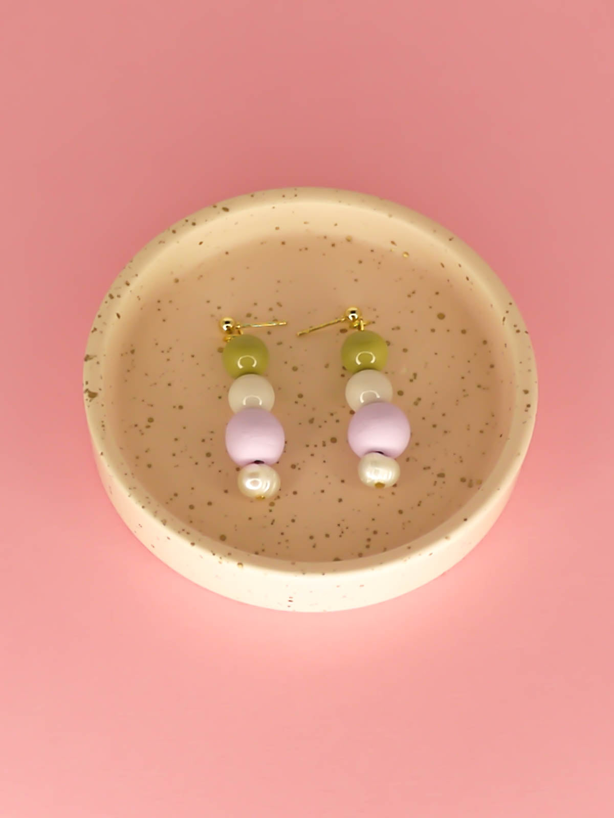 Pastel colour block earrings in green & white glass beads, with a hand rolled polymer clay bead in lilac and a mother of pearl bead, hung from 24k gold plated brass ball studs