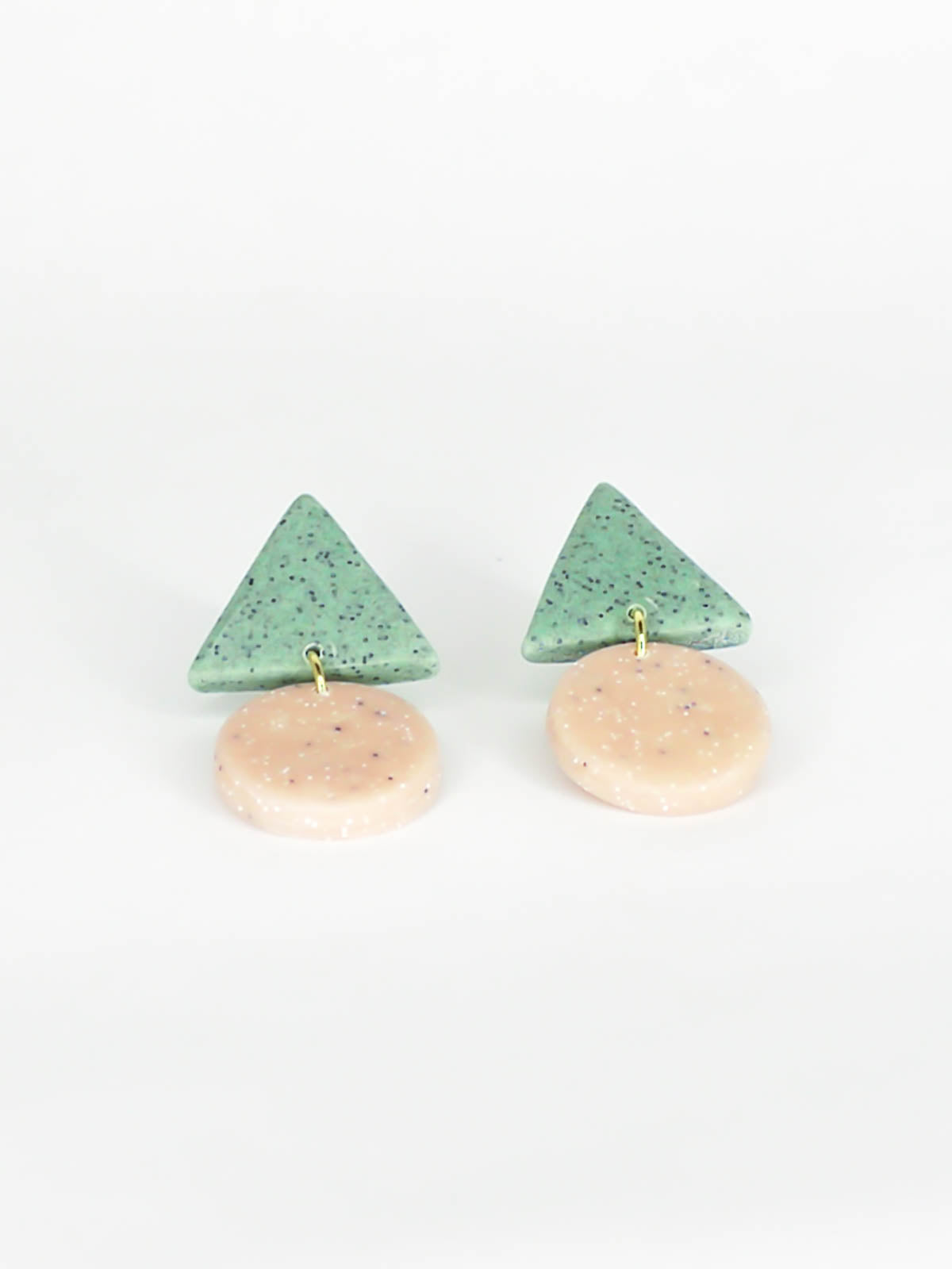 Geometric stud dangle earrings with a granite green triangle stud and a peach granite circle with stainless steel posts