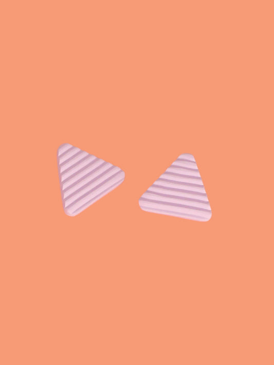 Lightweight lilac polymer clay triangle stud earrings in a fluted striped texture with stainless steel studs.