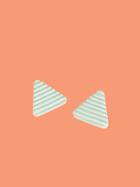 Lightweight mint polymer clay triangle stud earrings in a fluted striped texture with stainless steel studs.