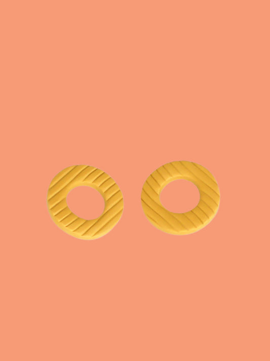 Mustard hoop stud statement earrings made out of polymer clay with a fluted striped texture and stainless steel posts