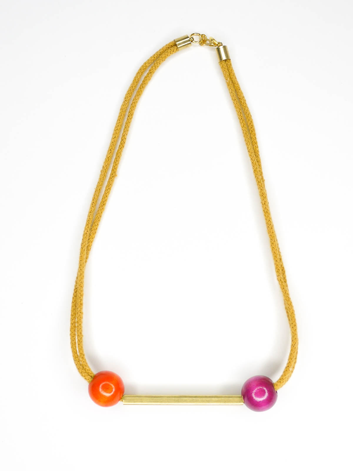 Mustard cotton rope bar necklace with a brass bar and contrasting wooden beads either side in orange and pink with a brass clasp