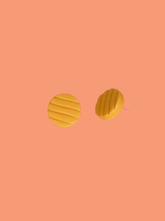 Mini mustard polymer clay studs in a textured stripe
