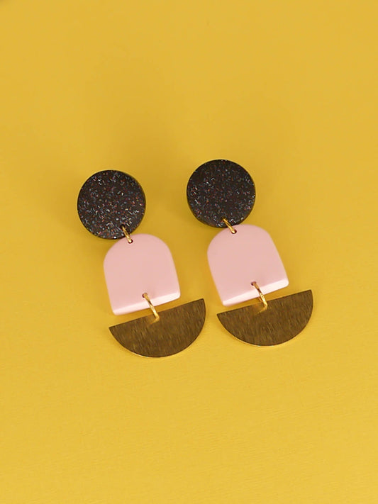 Geometric lightweight arch statement earrings with a black glitter polymer clay stud, a pale pink polymer arch and a textured brass semi circle